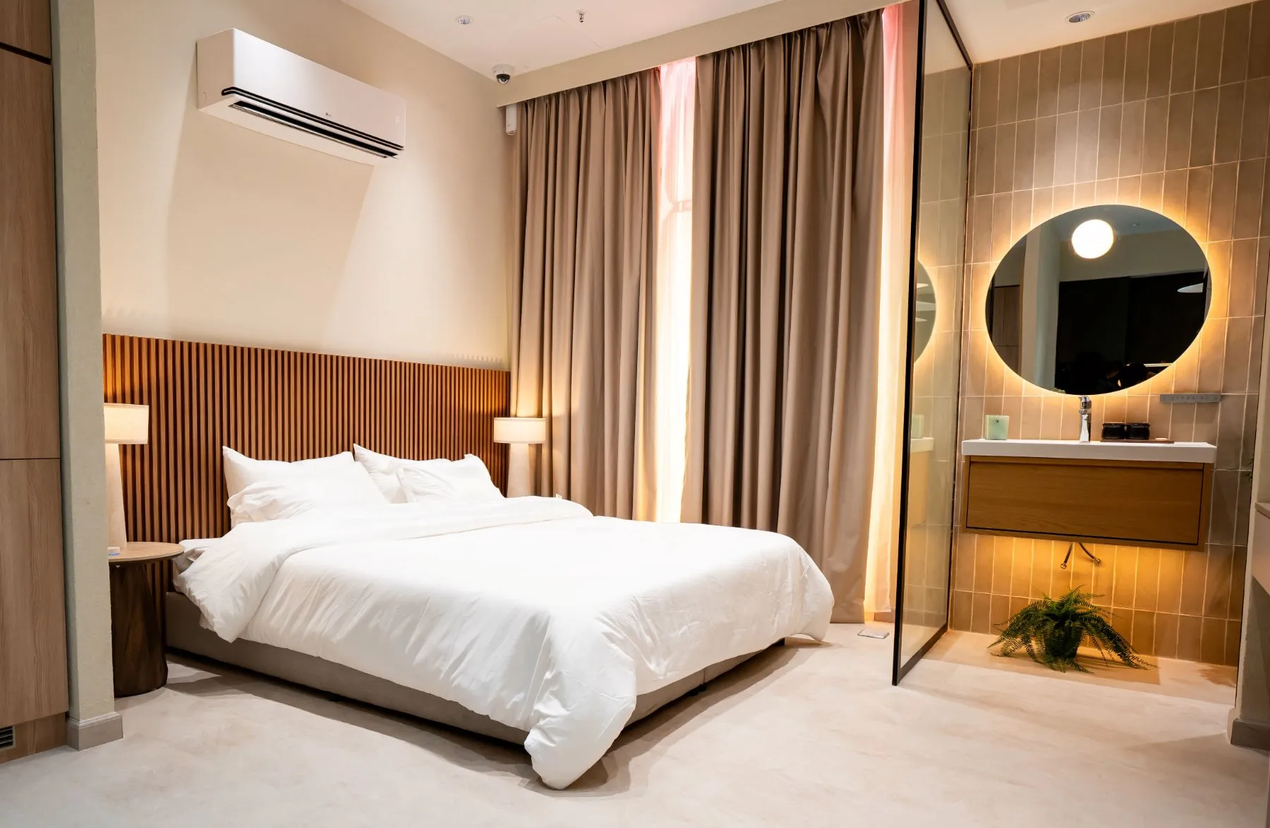 Bedroom setup at LG’s AI Home Experience Zone in Riyadh with an LG air conditioner, bed and connected living environment.