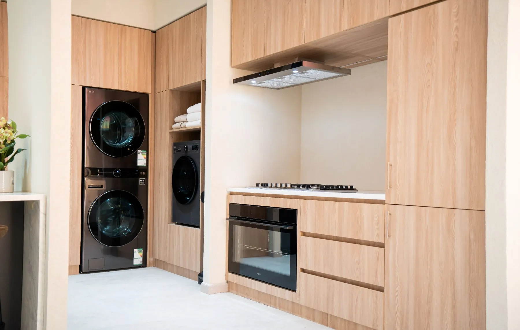 Built-in LG kitchen and laundry appliances integrated into cabinetry at the AI Home Experience Zone in Riyadh.