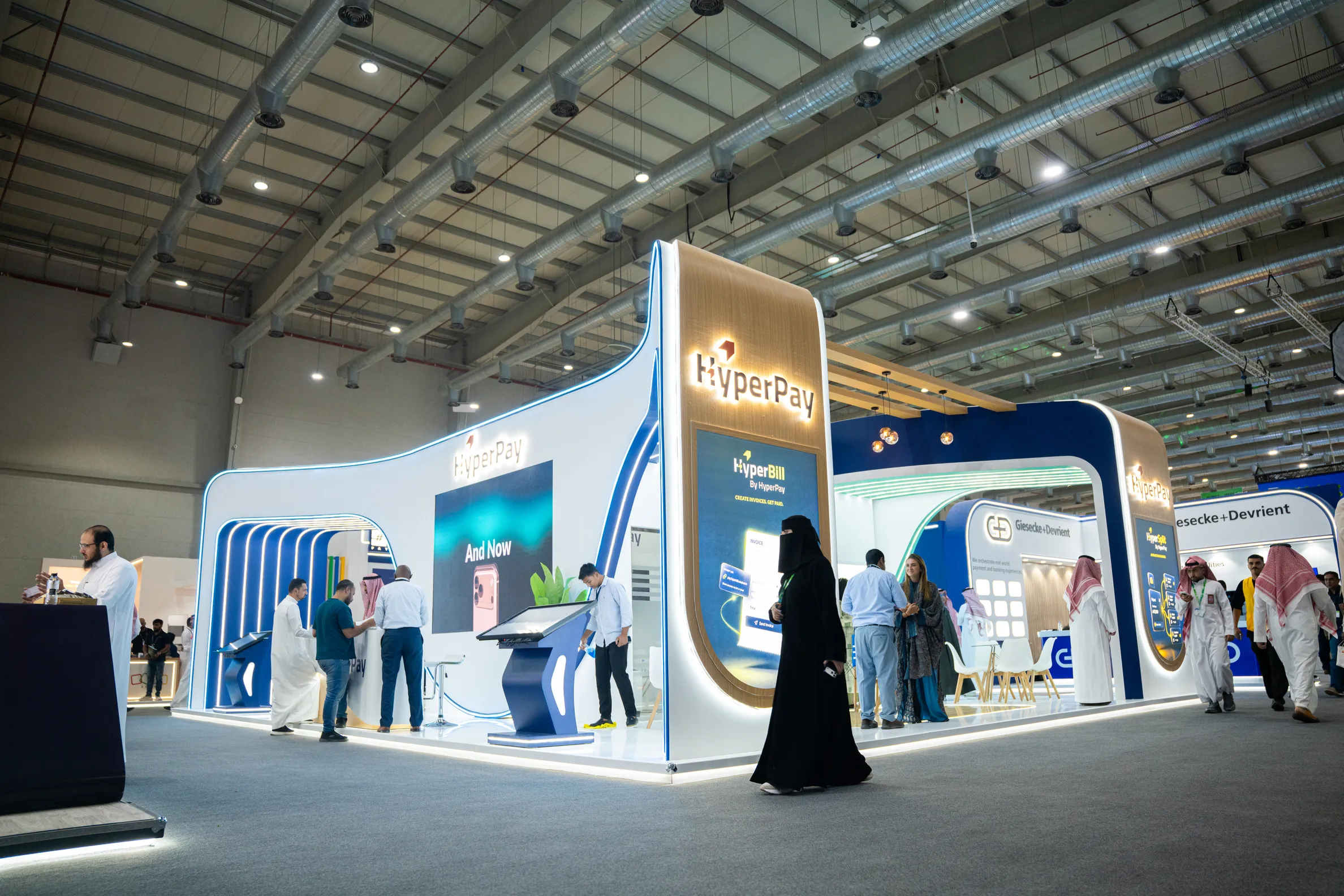 Visitors at the HyperPay exhibition stand during Money20/20 Middle East in Riyadh.