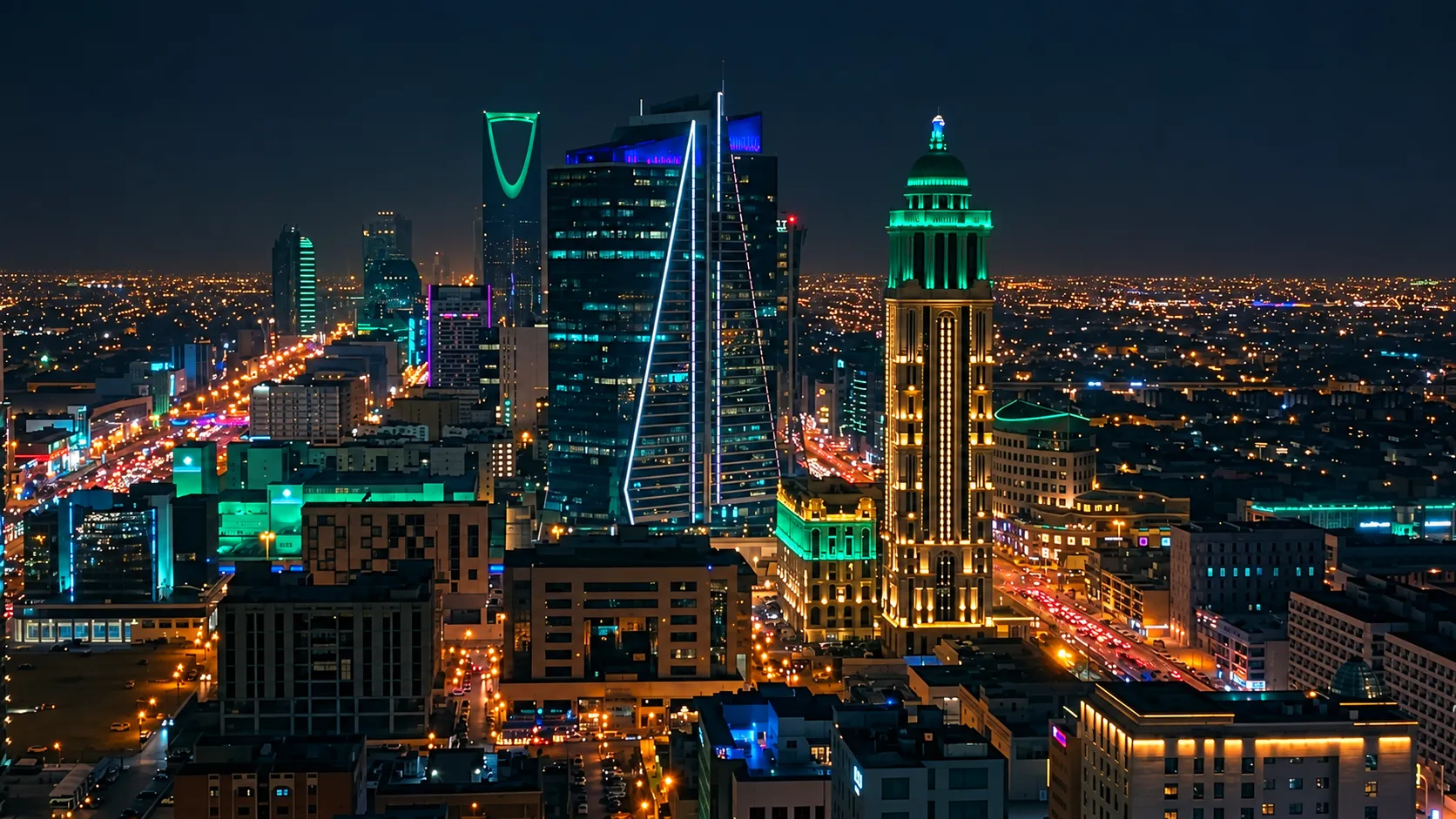 Riyadh skyline at night, with illuminated towers and roads; edited photograph by Saif Al Dhaher.