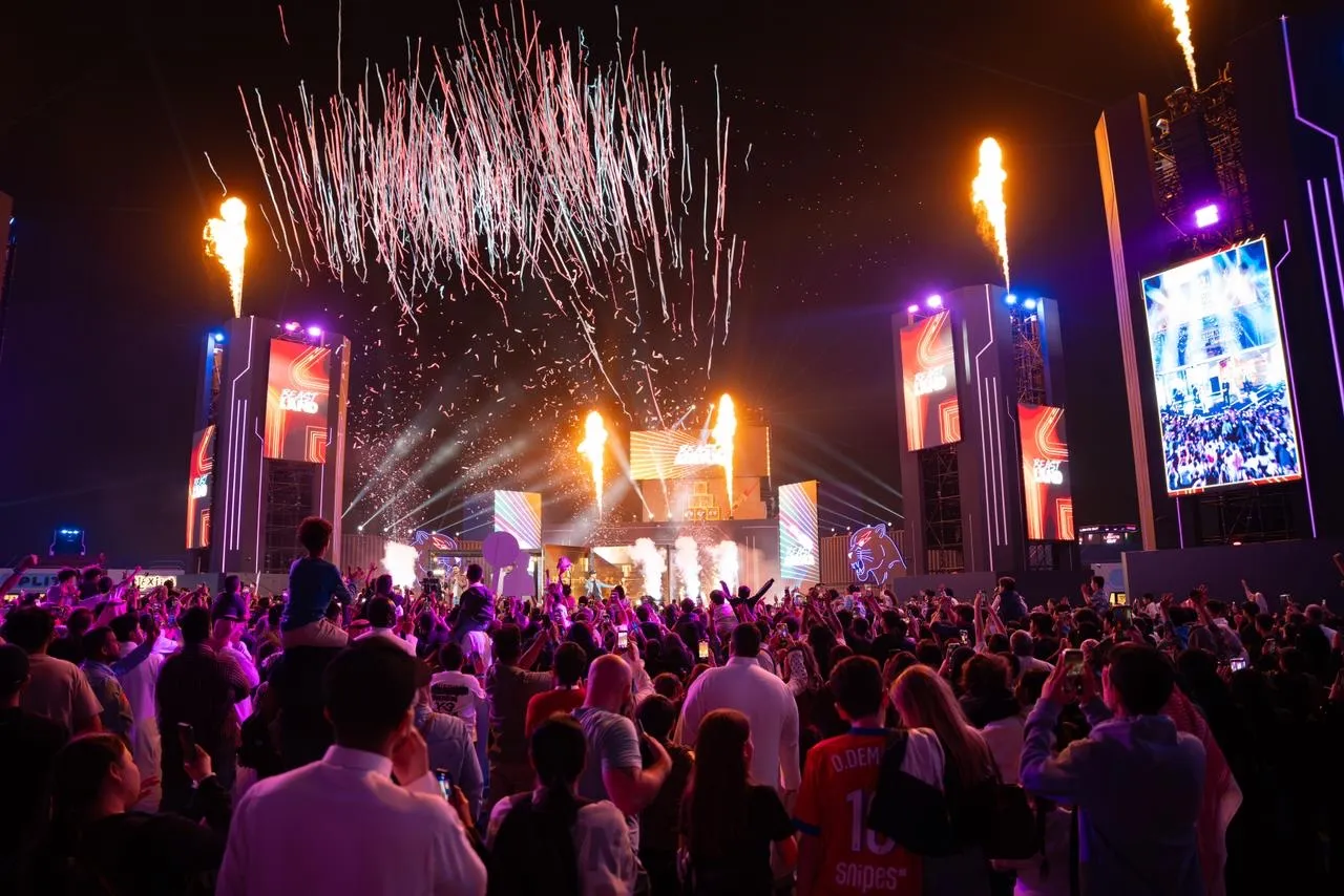 A large crowd watches fireworks and flame effects at the 2025 Beast Land launch in Riyadh
