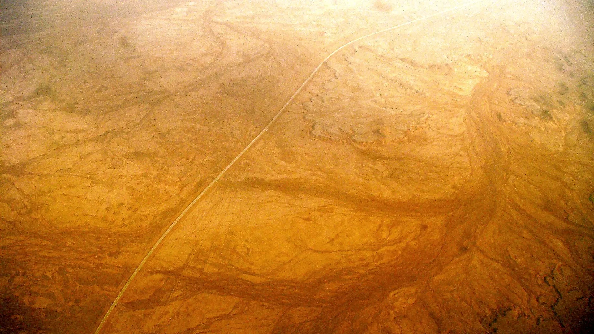 Aerial view of a highway crossing desert terrain near Riyadh